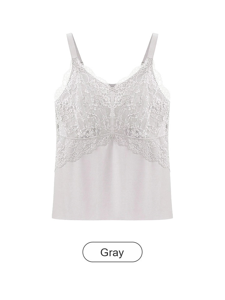 Esta elegante camisola está confeccionada en tejido transpirable de seda helada y presenta una silueta en línea A que disimula perfectamente el abdomen.