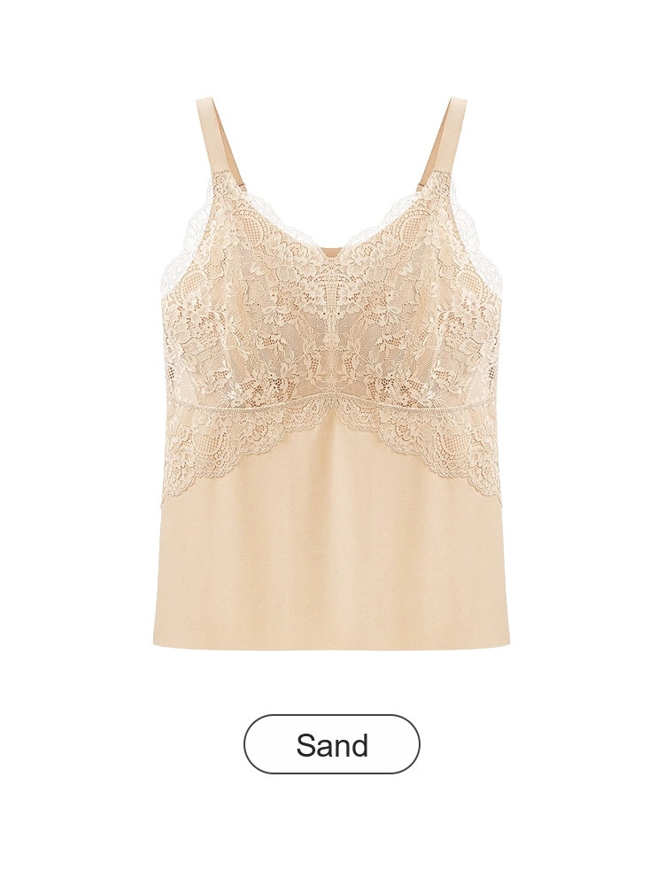 Esta elegante camisola está confeccionada en tejido transpirable de seda helada y presenta una silueta en línea A que disimula perfectamente el abdomen.