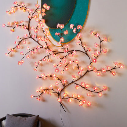 Las lámparas LED con forma de flor de melocotón se utilizan para decorar las paredes interiores y crear un ambiente romántico.